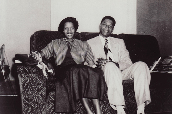Myrlie and Medgar Evers sitting together on a couch