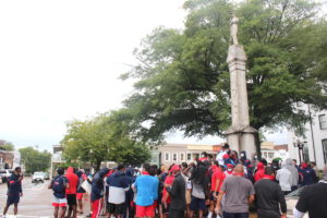 student athletes at Confederate monument in Oxford - Mississippi Free Press