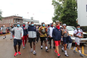 UM football team marches to protest racism - Mississippi Free Press