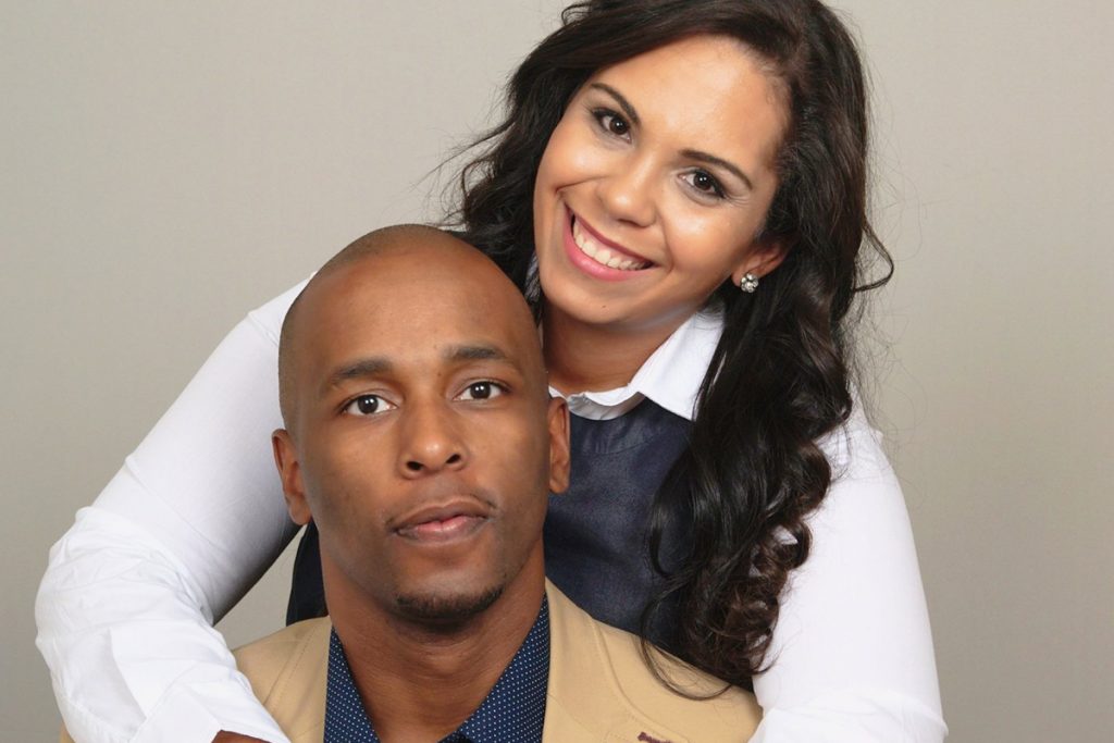 Moss Point Mayor Mario King poses for a portrait with his wife, Natasha King, who wraps her arms around his chest as both look directly into the camera in a 2017 photo.