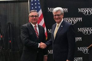 Senator Mike Thompson shakes hands with ex-Governor Phil Bryant