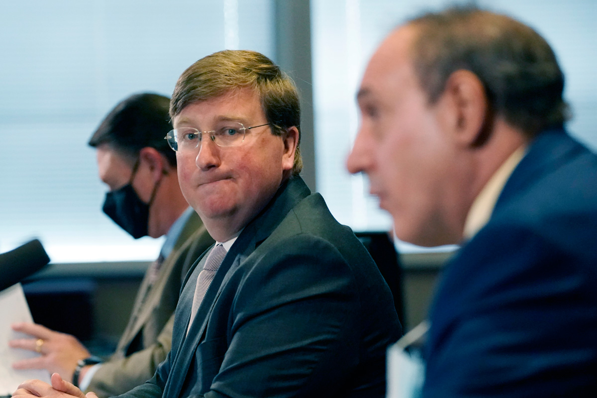 Tate Reeves looking in the distance with Paul Byers in the foreground