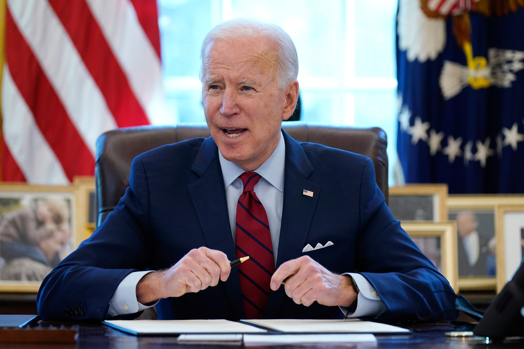 President Joe Biden speaking at his desk