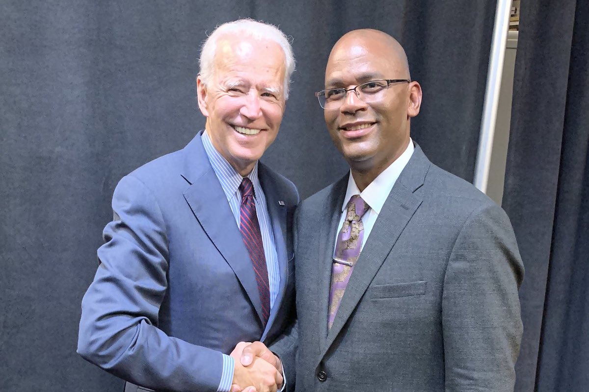 De'Keither Stamps and President Biden shake hands