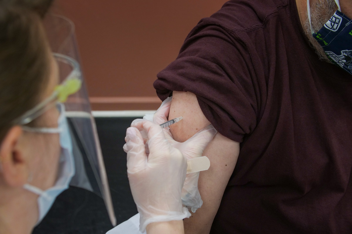 Patient receiving a covid-19 vaccination