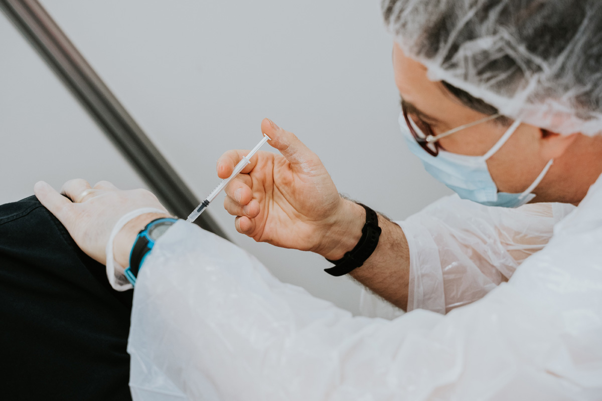 Doctor administering vaccine