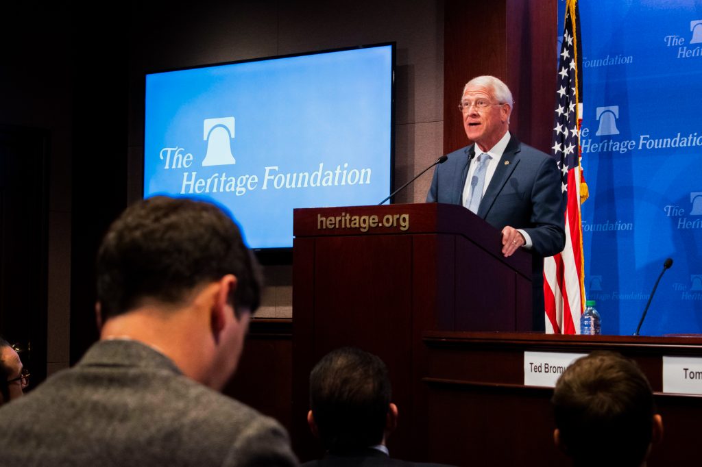 Senator Roger Wicker speaks at a podium with the words "The Heritage Foundation" on the wall behind him.