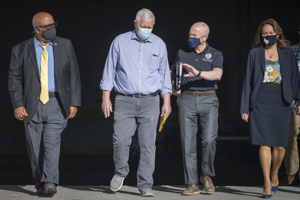 Bennie Thompson is seen walking on a road alongside three other people, including Homeland Security Secretary Alejandro Mayorkas