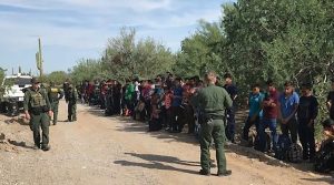 Border Patrol with 128 detained people
