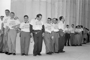 Men wearing "Free Willie McGee" shirts, chained to the Lincoln Memorial