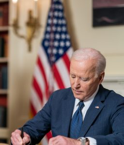 Joe Biden signing in his office