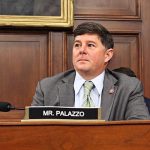 Steven Palazzo sits at a seat in a committee hearing