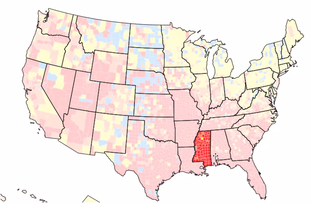 A map of the United States, with Mississippi highlighted. The state's counties are outlined and all but one are either light or dark red, indicating rapid spread of the virus.