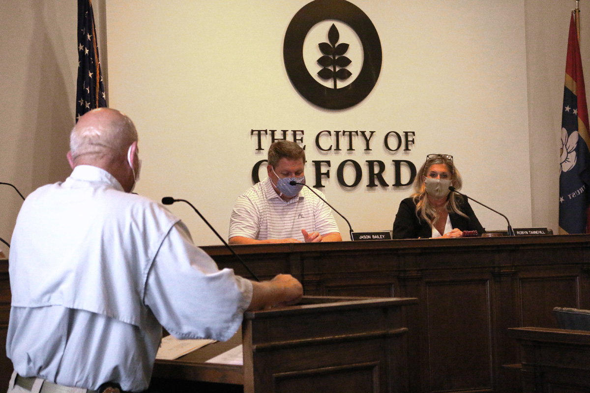 Masked members of Oxford city council at a meeting