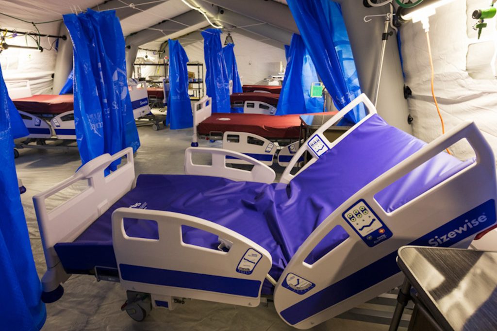 Hospital beds in a tent hospital