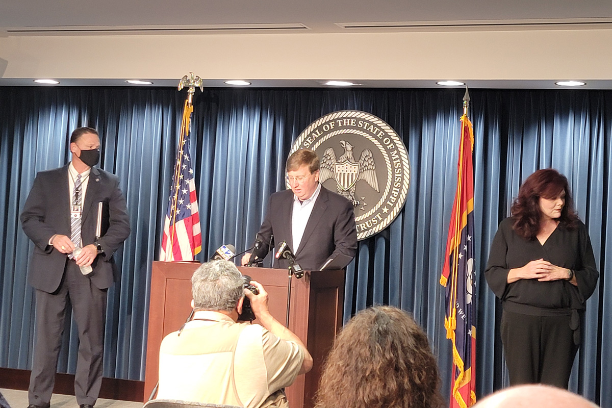 Tate Reeves at podium