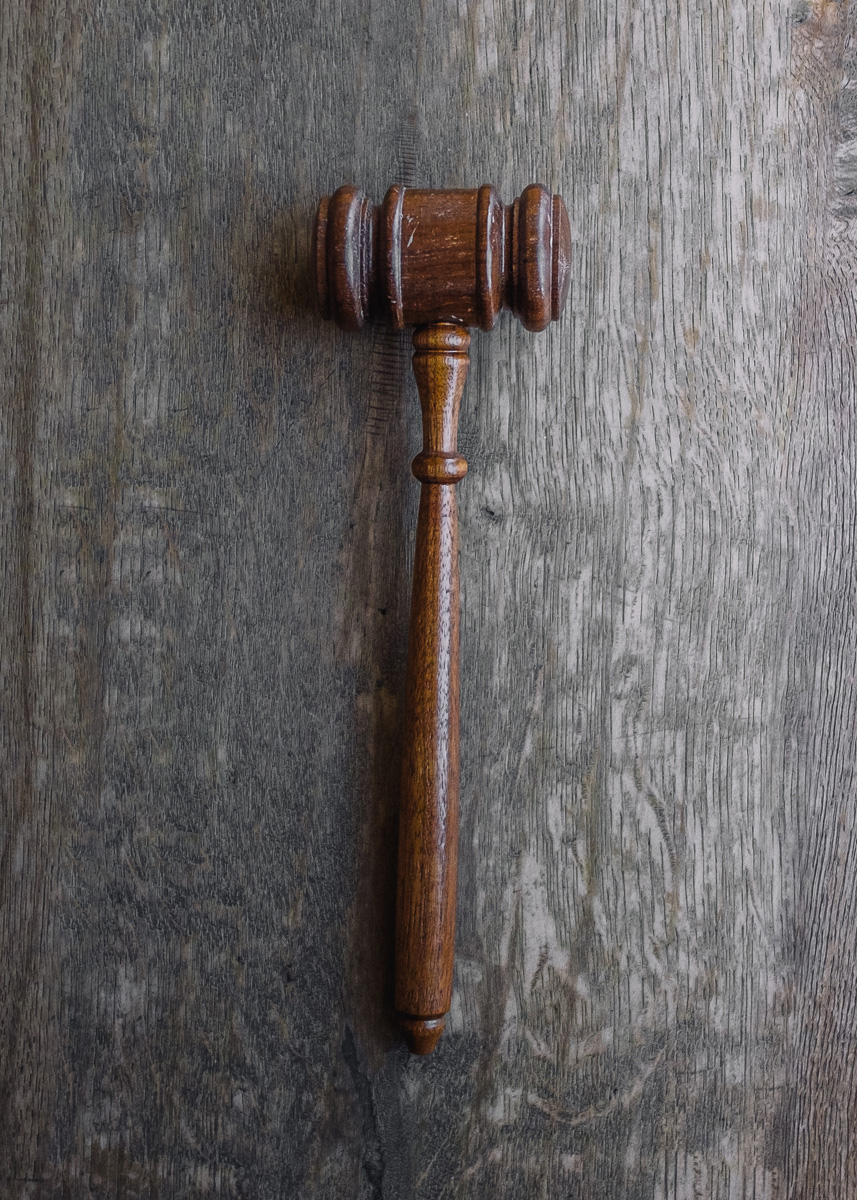 Judge's gavel on a wooden background