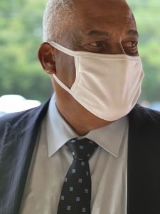 Jackson-based attorney Dennis C. Sweet III wearing a suit and white mask