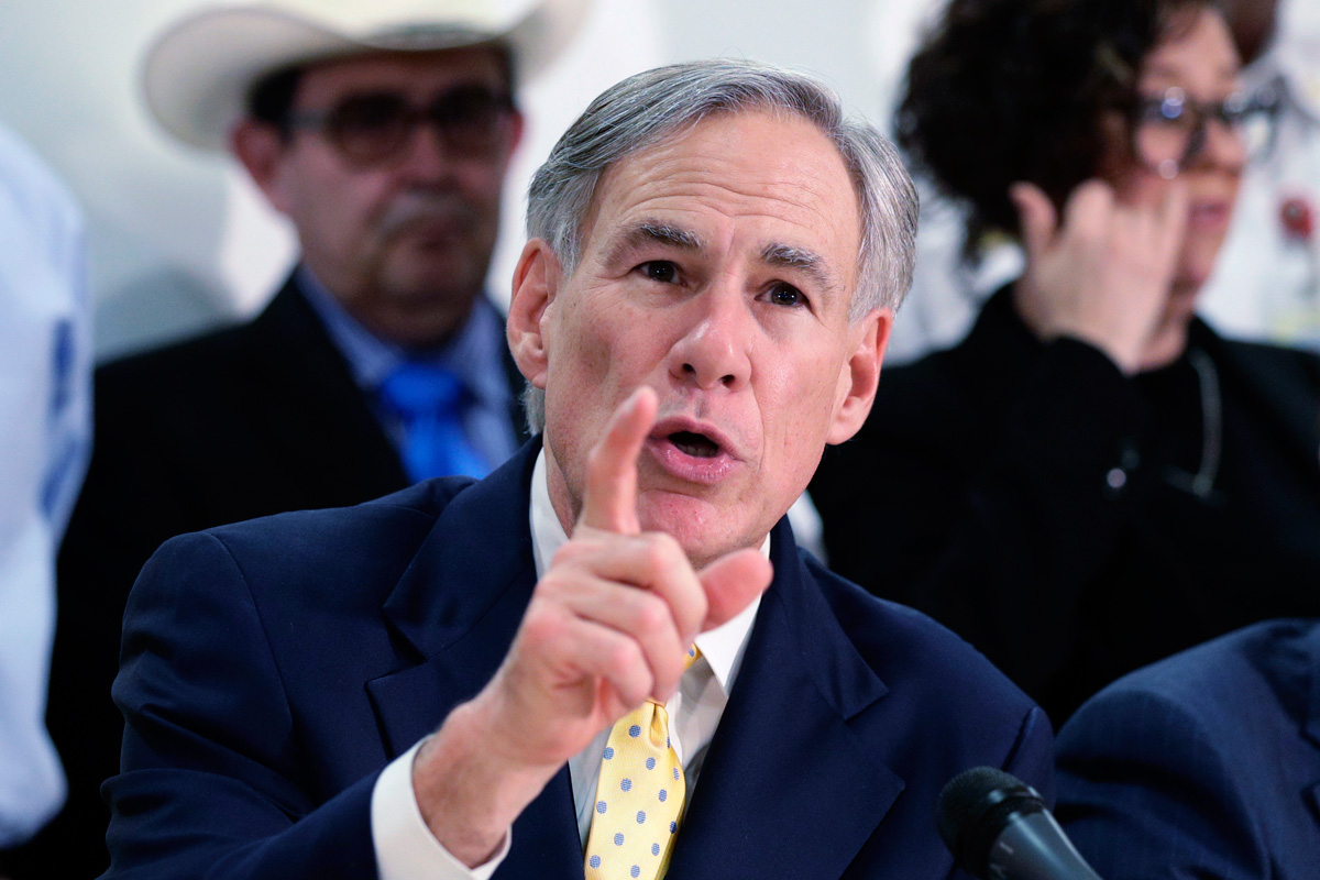 Texas Gov. Greg Abbott pointing and talking at a microphone