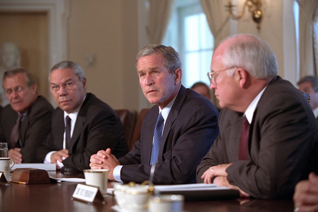 a photo of Colin Powell, George W. Bush, Dick Cheney and Donald Rumsfeld in the cabinet room of the White House