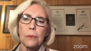 Lilly Ledbetter on zoom, with short blonde hair and black rimmed glasses