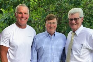 a photo of Brett Favre with Tate Reeves and Phil Bryant