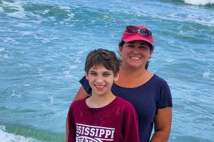 A photo of Bryan Loftin and his mom Christine Loftin at the beach. She believes medical marijuana could help save his life