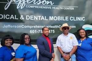 Jefferson Comprehensive Health Center’s mobile unit team with the Sheriff