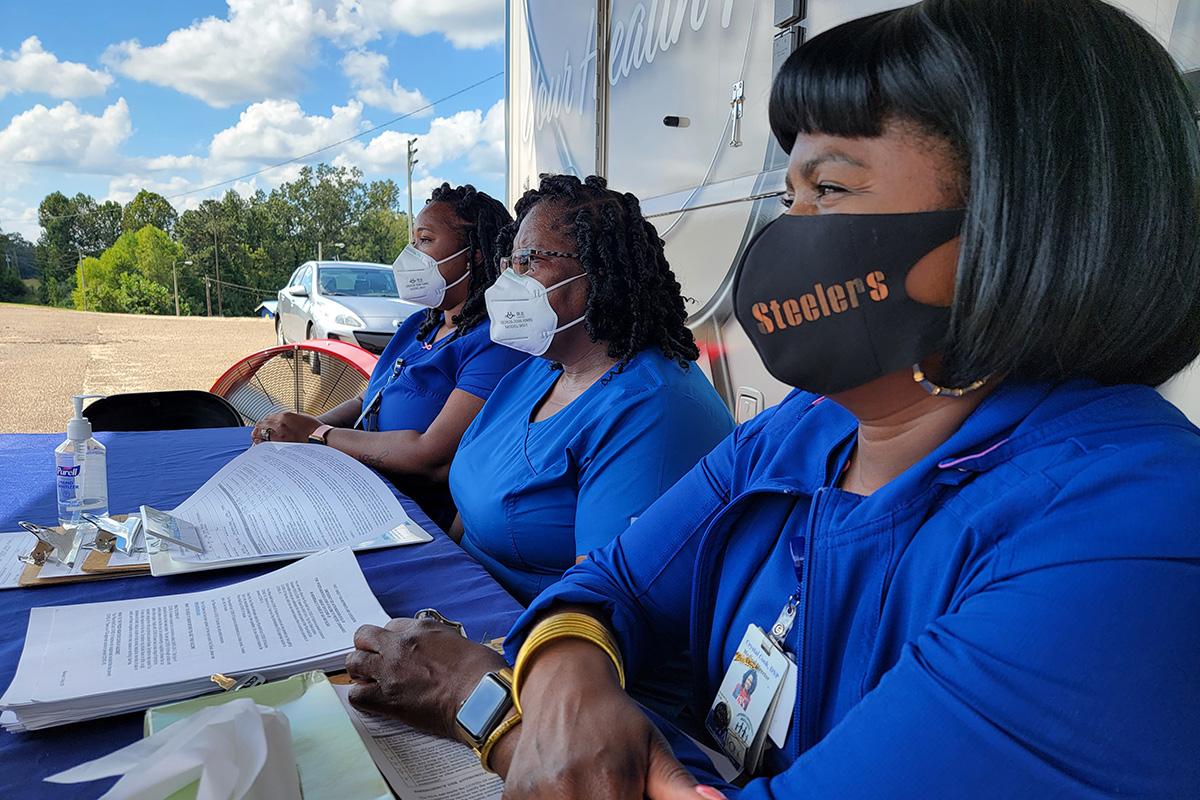 Pictured right to left are Medical Director Crystal S. Cook, LPN Nekita Ellis and mobile unit driver Lorraine Ware