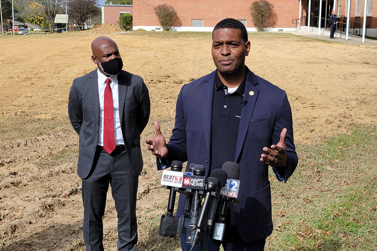 Michael Regan outside Wilkins Elementary with Errick Greene