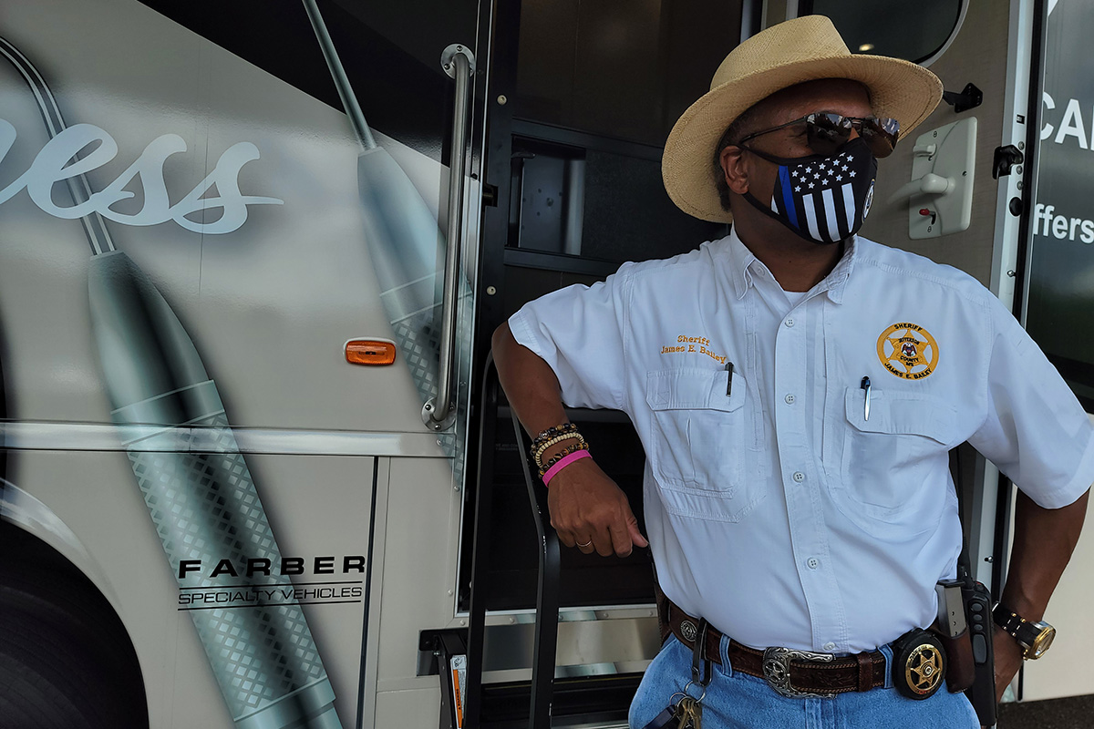 Jefferson County Sheriff James. E. Bailey standing outside of a mobile medical bus