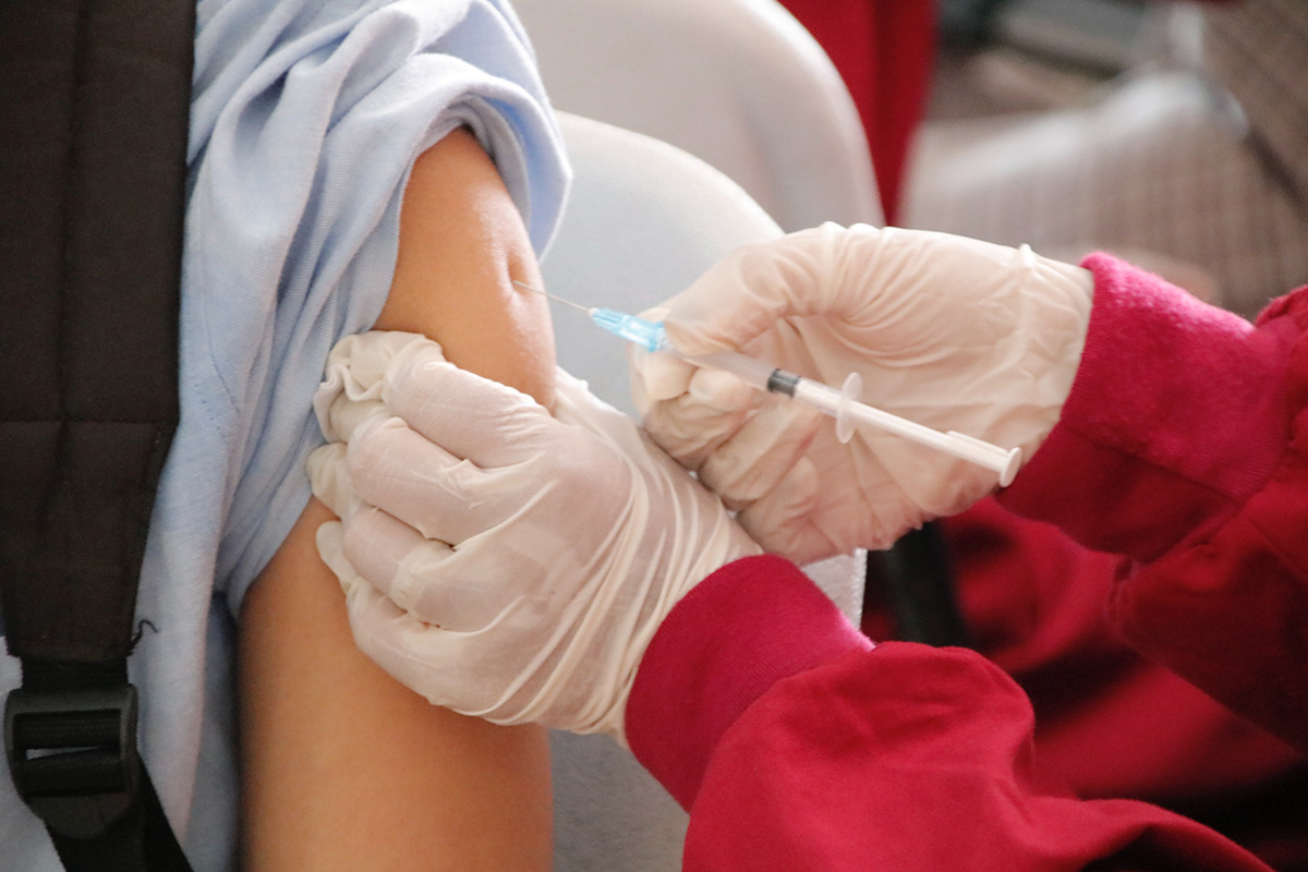 student getting vaccine