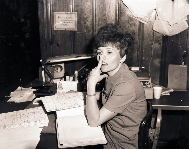 A woman thinks at her desk.  Photo by Bonny Parham / courtesy Amory Regional Museum