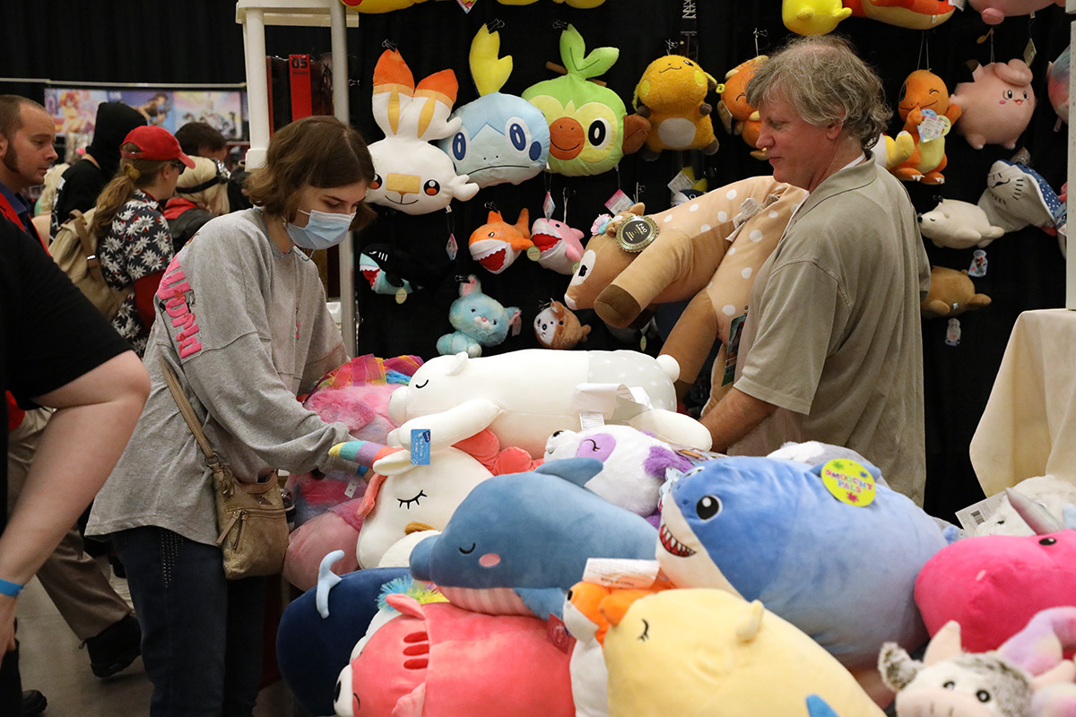 Customers perusing colorful plushie figures