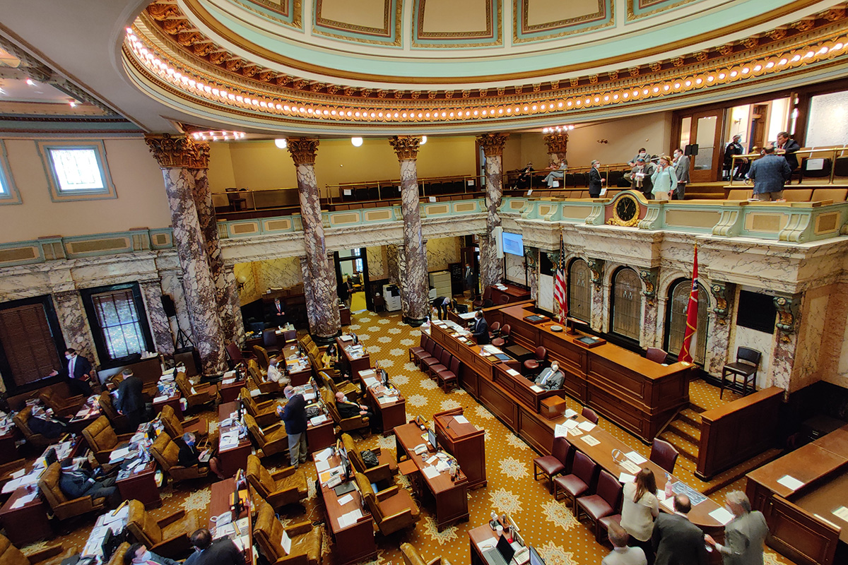 Interior view of the Mississippi Legislative Hall with people at work