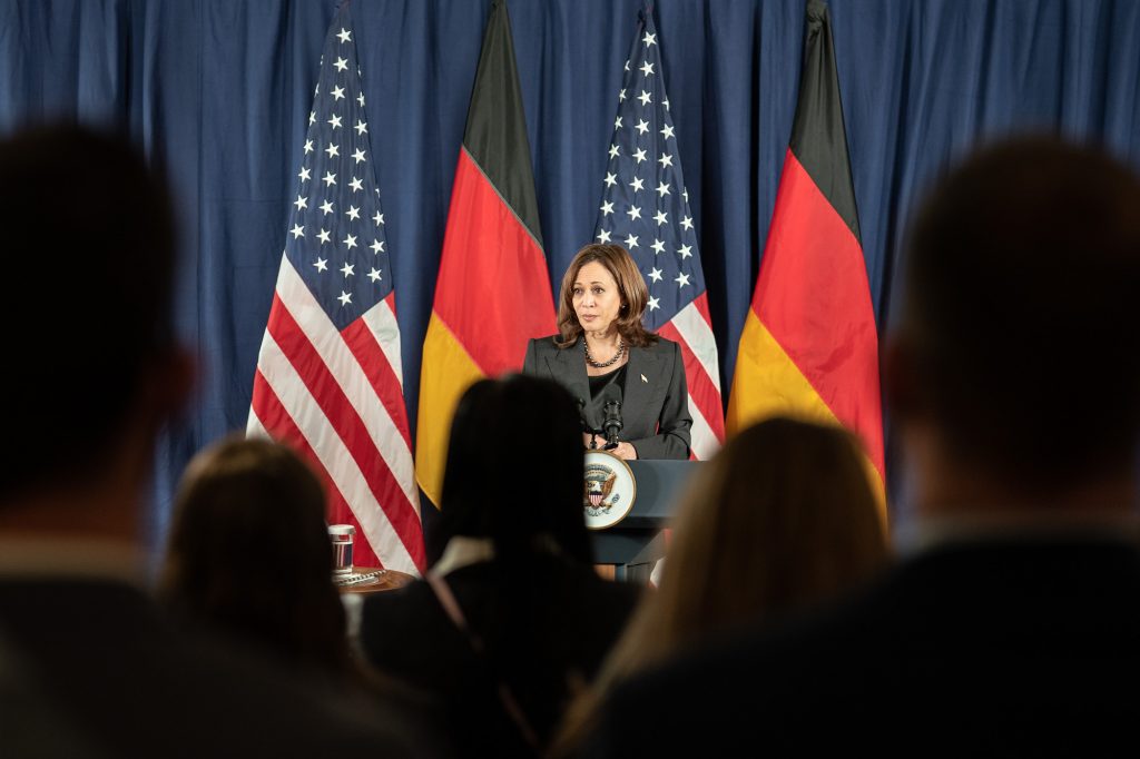 a photo of VP Kamala Harris in front of American and German flags