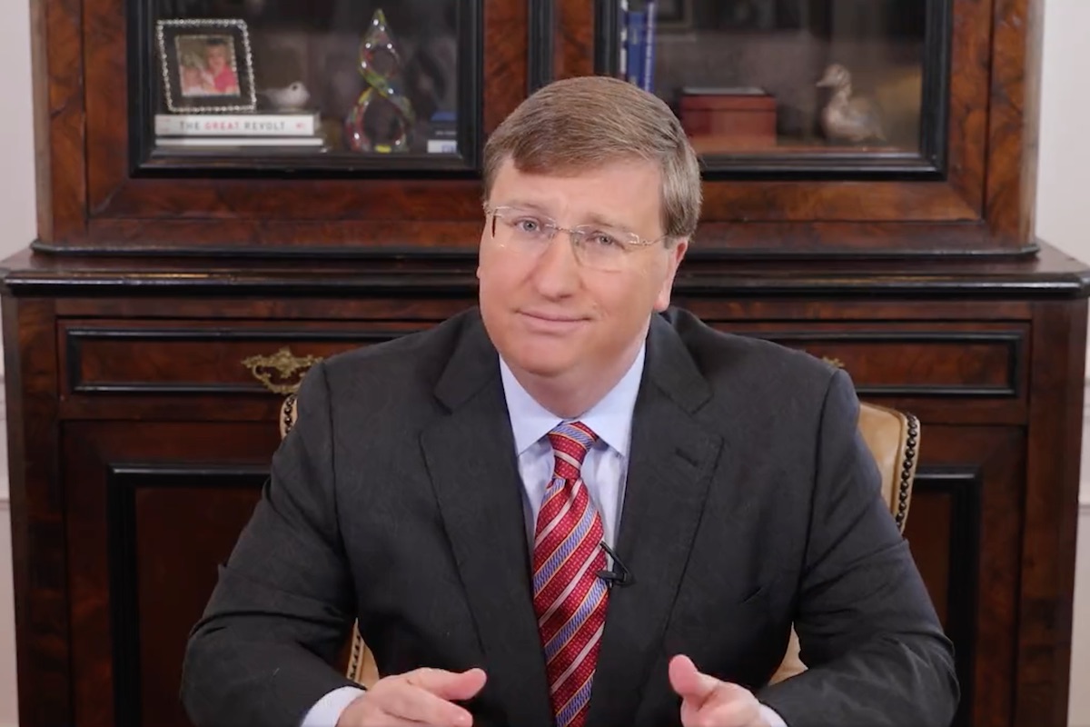 A photo of Governor Tate Reeves smirking