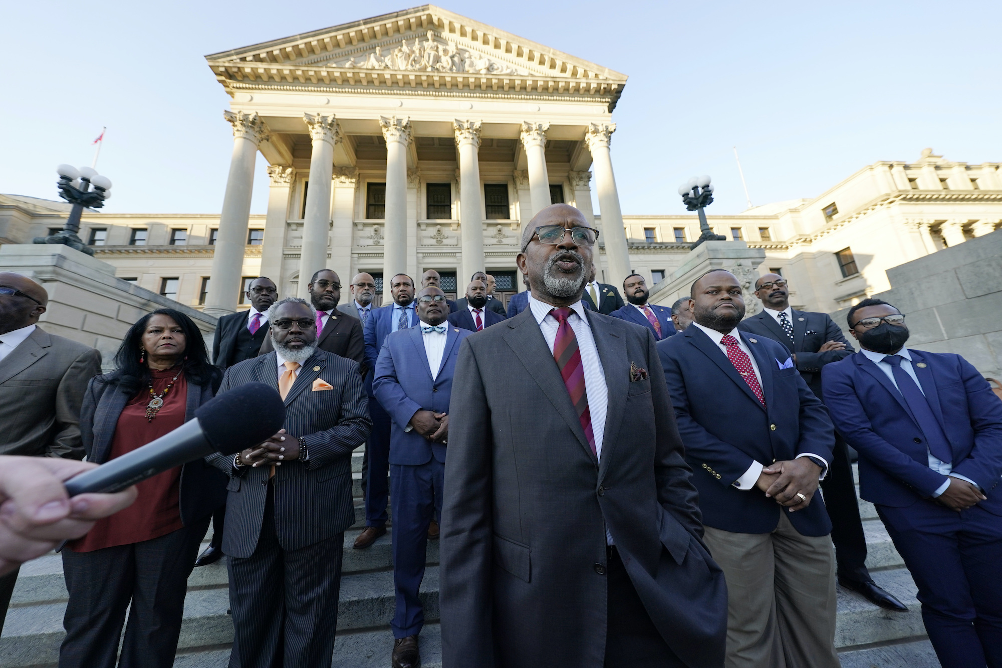 a photo of Black Democratic lawmakers standing on the steps of the Capitol