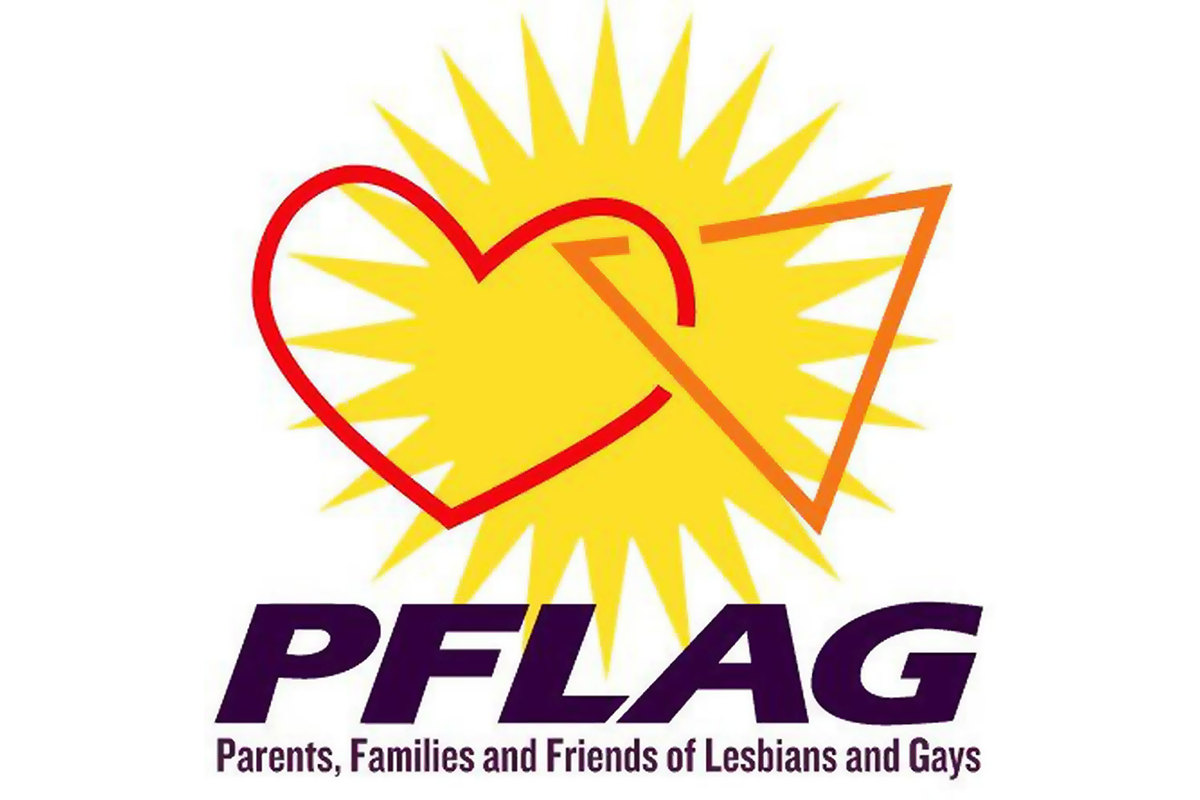 PFLAG logo of a yellow starburst, with an interconnected heart and triangle overlayed