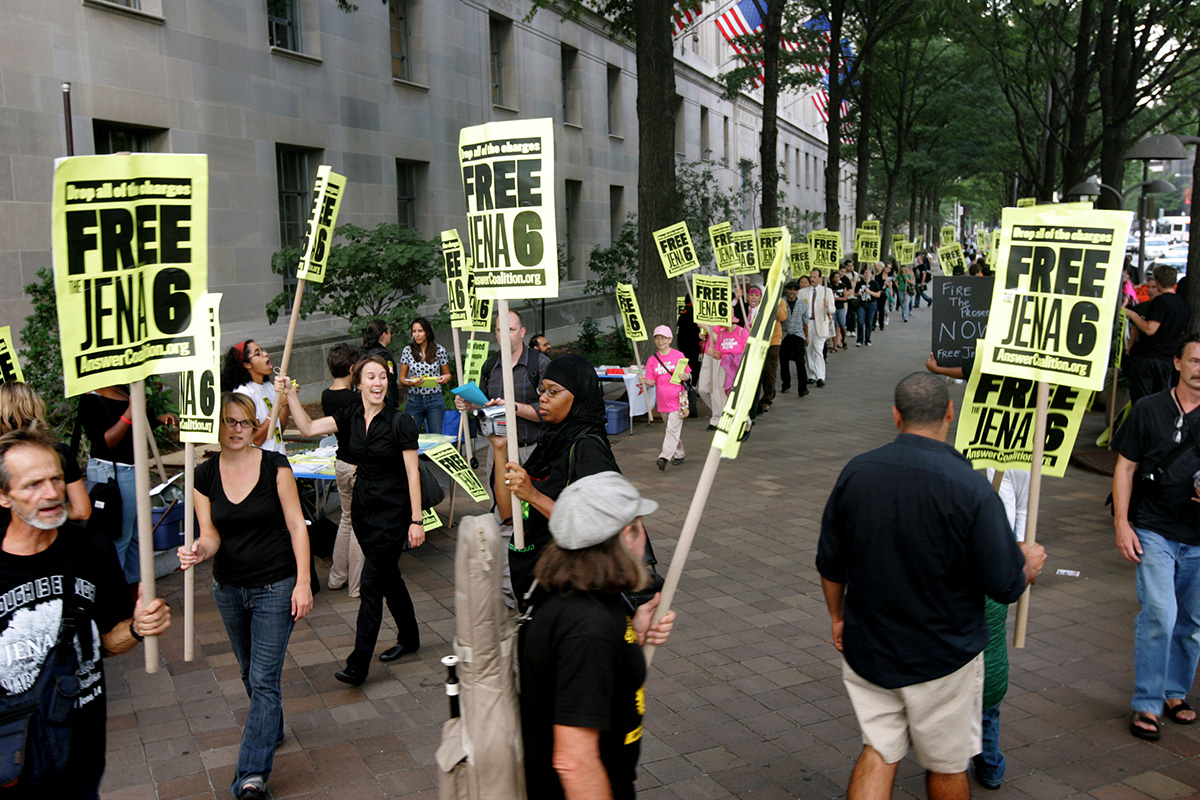 Protesters outside the U.S. Justice Department to demand all charges be dropped against the Jena six in Washington, Tuesday, Oct. 2, 2007.