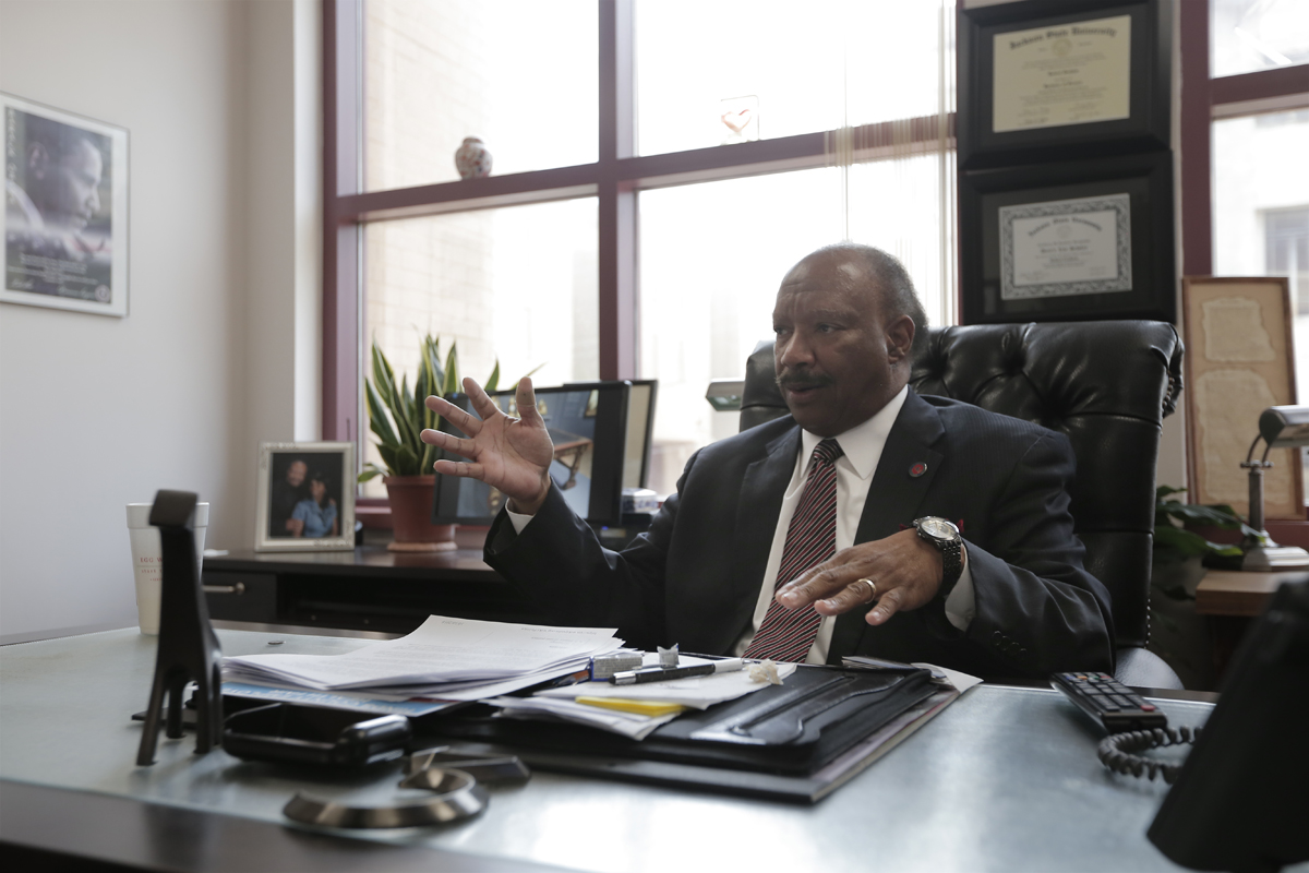Robert Graham sitting at a desk