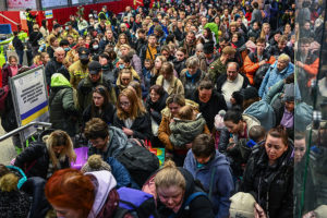 Ukrainians fleeing the war walk toward a train in Krakow to bring them to Berlin on March 15, 2022.