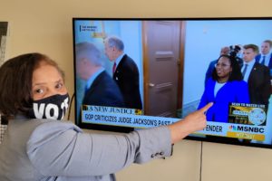 photo shows Dianne Dodson pointing at Ketanji Brown Jackson on a television screen