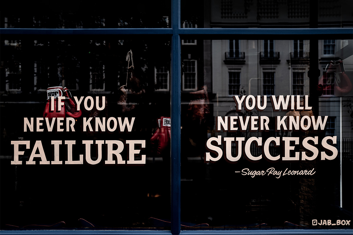 A window with this written on it: If you never know failure, you will never know success - Sugar Ray Leonard"