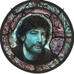 Round stained glass of author Neil Gaiman