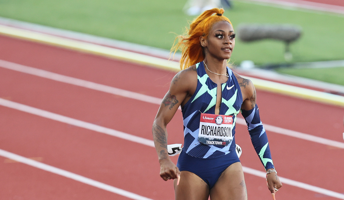 Sha'Carri Richardson running track dressed in a blue geometric body suit