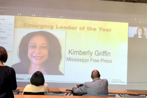 A powerpoint presentation on the screen showing that Kimberly Griffin is Emerging Leader of the Year