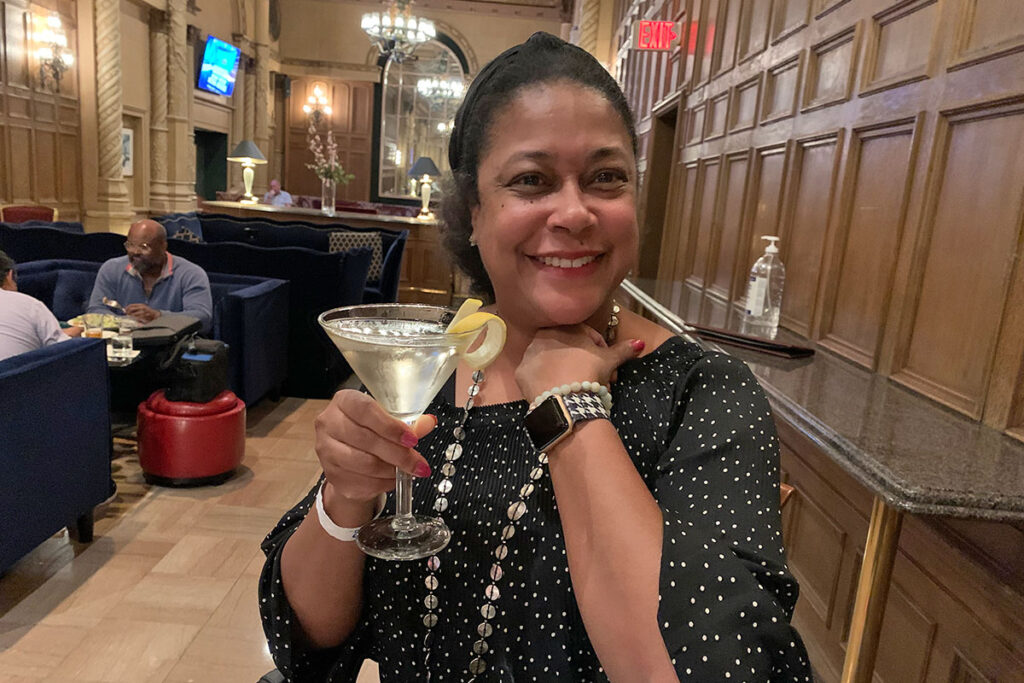 Kimberly Griffin celebrates her Emerging Leader of the Year award with a cocktail (nonprofit news awards)