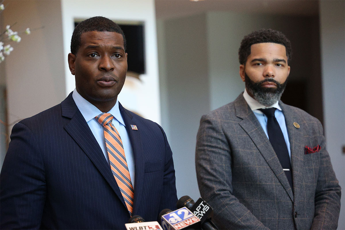 Michael Regan and Chokwe Lumumba speak at a press conference