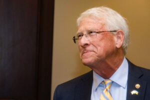 a photo of Senator Roger Wicker's face, sucking his mouth in as he smiles tightly